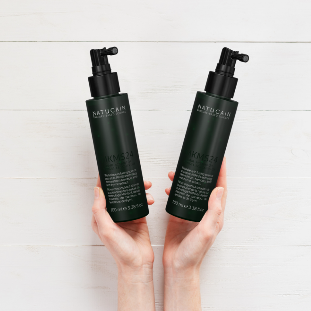 Natucain Hair Activator (100 ml.) two in hand
