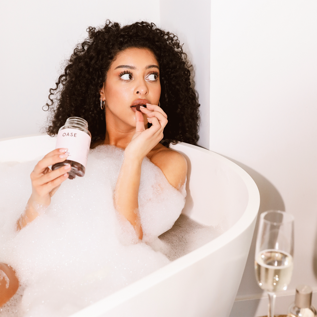 oase hair vitamins influencer box single model in bath taking gummy